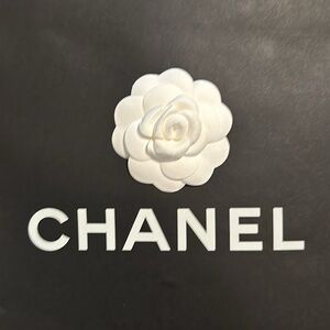 Four authentic Chanel shopping items for sale.